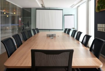 Empty meeting room, focus on chair of chef